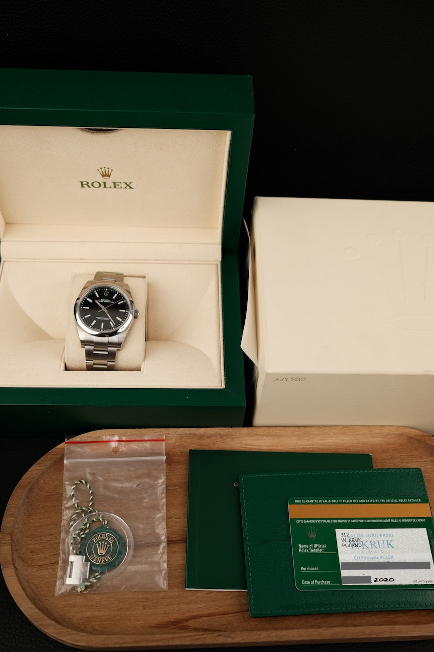 Rolex Oyster Perpetual 39  114300 Box + og. Papiere Black Dial