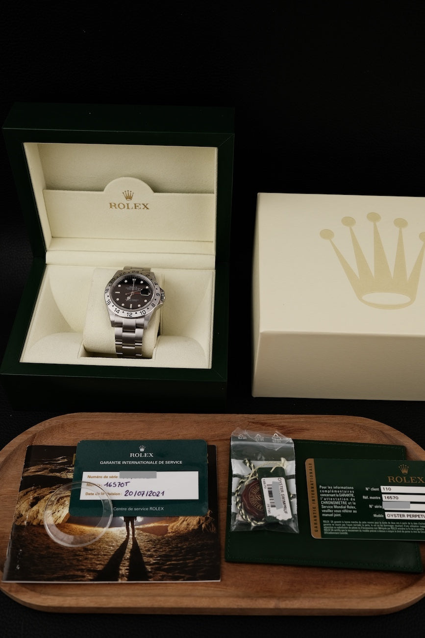 Rolex Explorer II 16570 Box + og. Papiere V Series Rolex Service 2021 NEW Card Rehaut Mint Condition